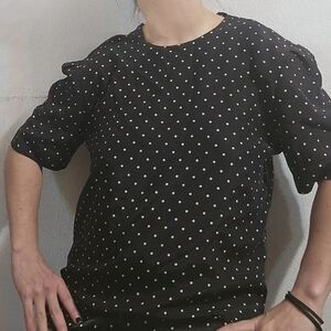 Indulge in timeless elegance with our classic white polka dot blouse.